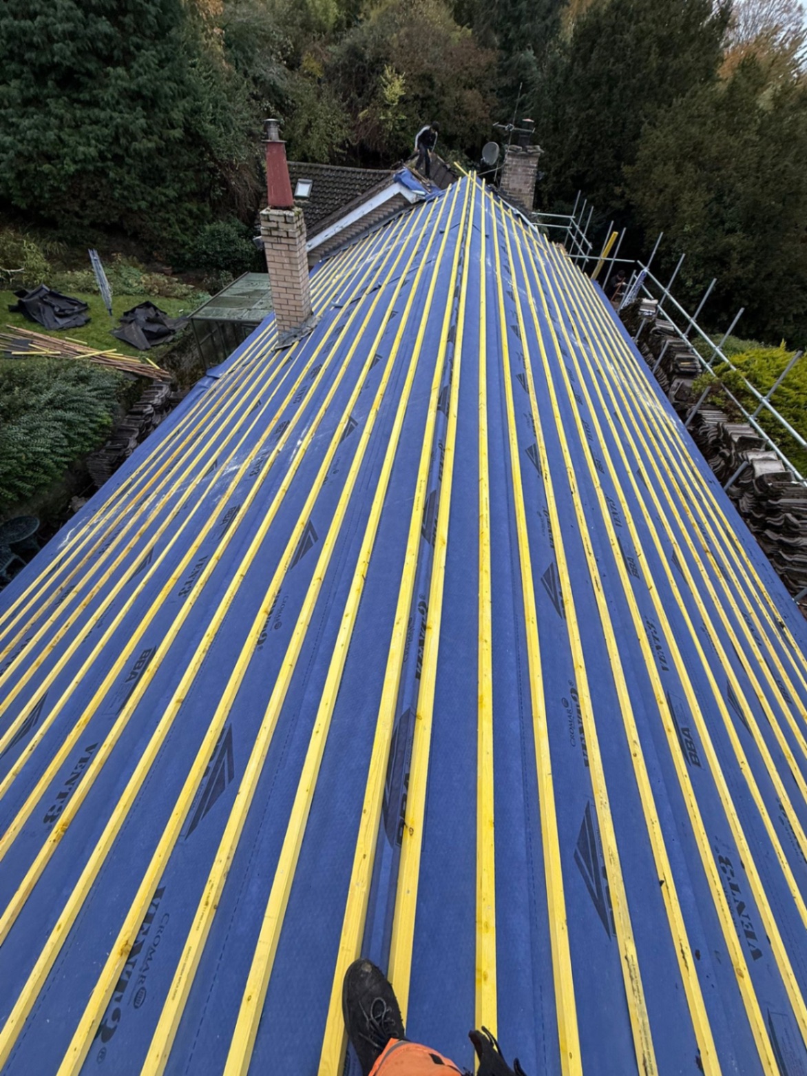 Full roof strip and re-felt with new battens — breathable membrane installed